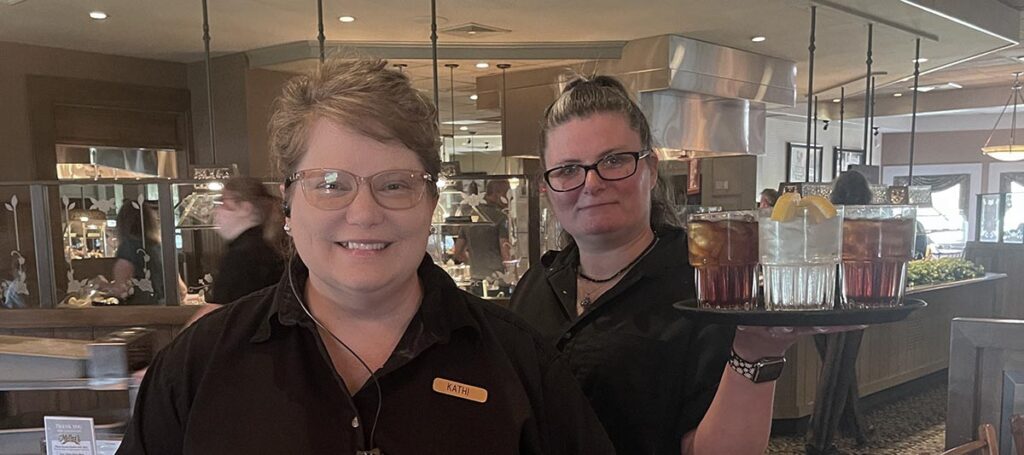 Servers serving coffee and beverages at Miller's Smorgasbord